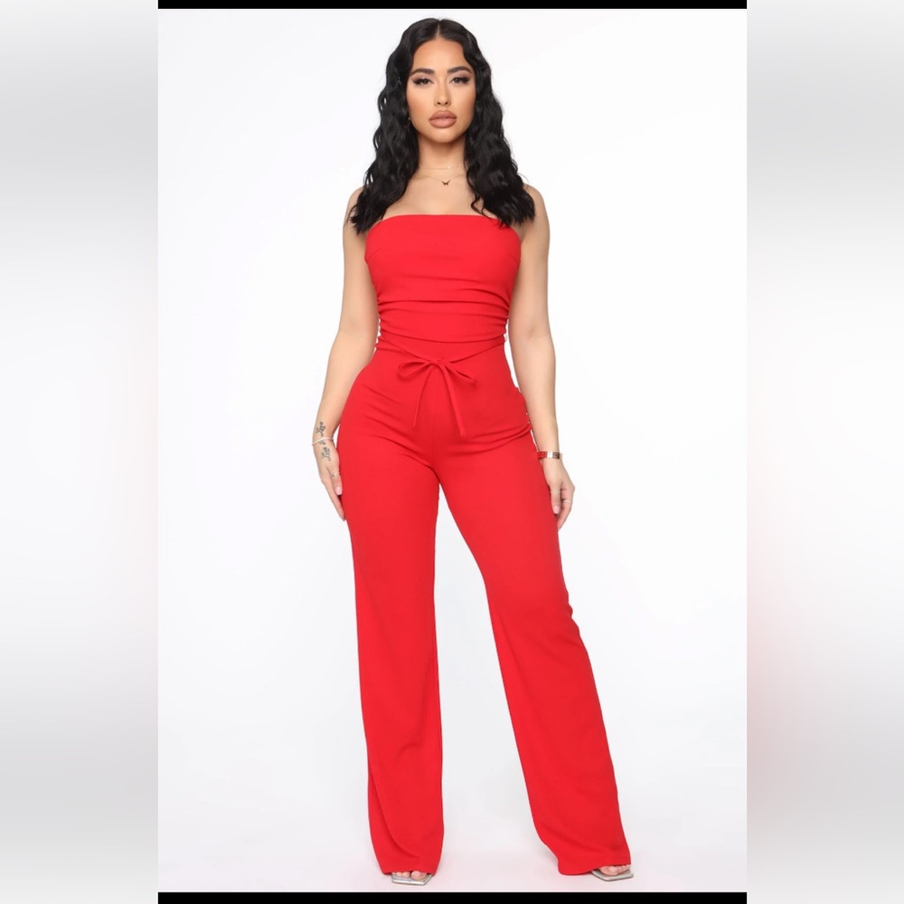 Bright red tube top jumpsuit w/ tie back. Size Medium.